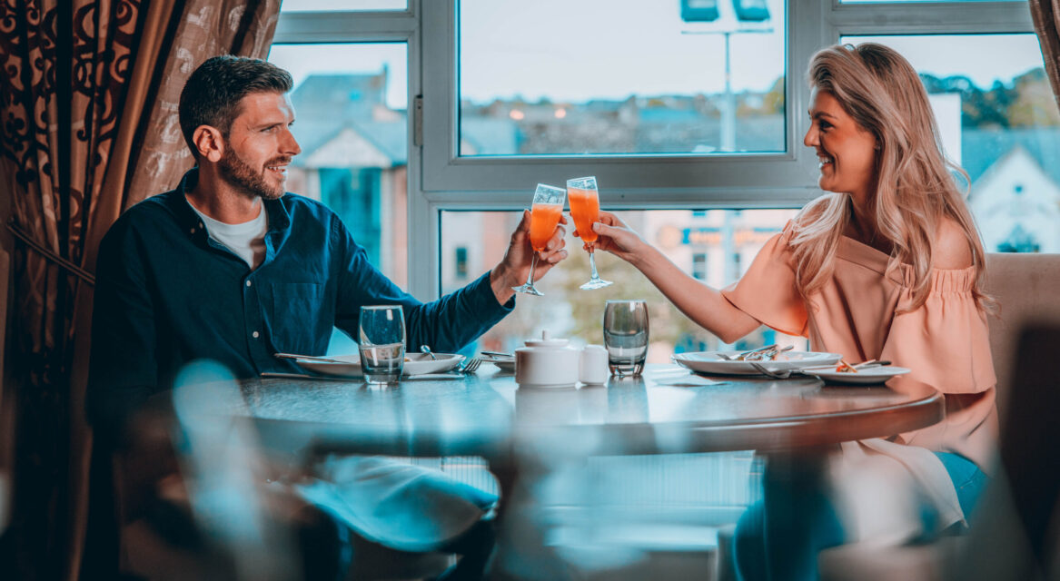 Couple saying Cheers Visit Mourne